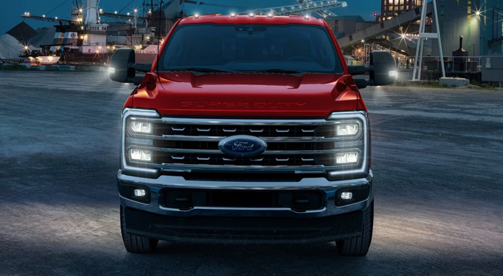 Red 2026 Ford F-250 shown from the front at night.
