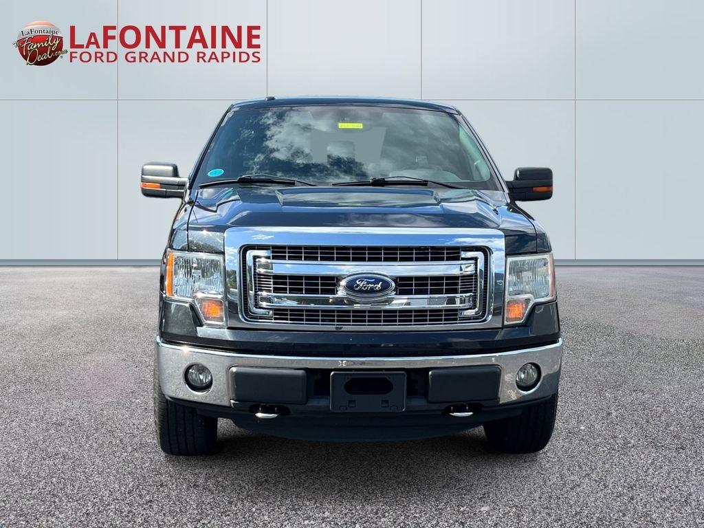 Used 2014 Ford F-150 XLT with VIN 1FTFX1EF8EFB58664 for sale in Grand Rapids, MI