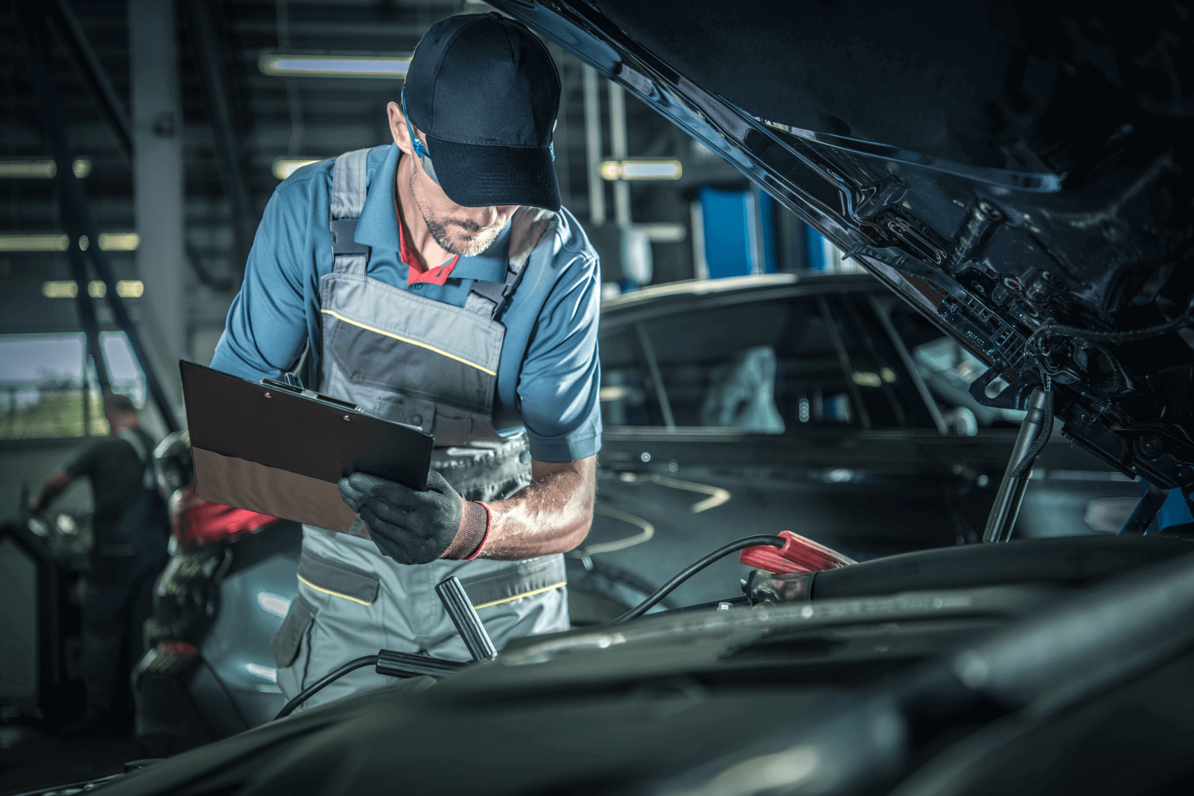 Service Technician Looking at a Ford Vehicle