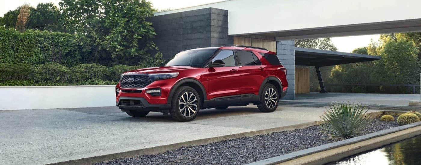 Red 2023 Ford Explorer ST backed into a driveway