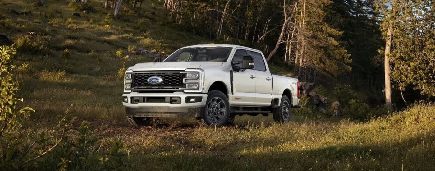 White 2024 Ford F-350 Lariat Super Duty parked off-road