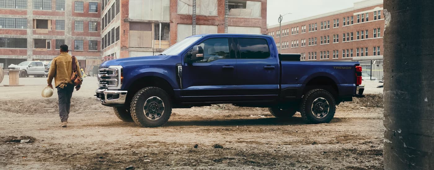 Blue 2026 Ford F-250 parked at a construction site.